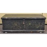 A large early 20th century chest/trunk with ebonised hinged top revealing trays