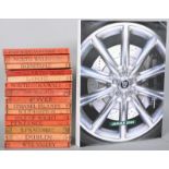 A set of fourteen Ward Lock travel books along with a Jaguar 2001 hardback book.