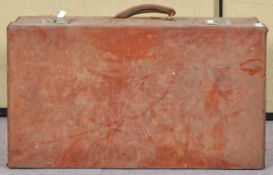 A brown leather suitcase