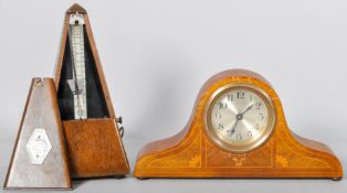 An Edwardian small mahogany and inlay Napoleon hat clock along with a metronome.