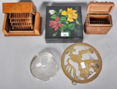 A collection of boxes along with a trivet stand and tray