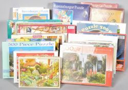 A collection of assorted boxed jigsaws