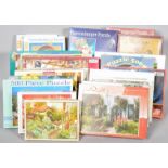 A collection of assorted boxed jigsaws