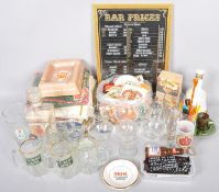 A collection of assorted of pub paraphernalia to include glasses, bar towels, ashtray, beer mats,