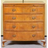 A reproduction chest of two short and three long drawers, fitted brushing slide,