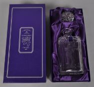 An Edinburgh crystal decanter etched with a golfer in fitted case