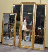 Four gilt framed full length hall mirrors. Largest measures; 128cm x 43cm.