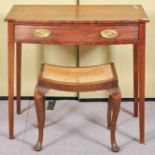 A mahogany ladies desk with single drawer raised on tapering legs with an oak cane work stool.