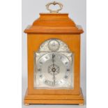 A Queens Jubilee mahogany mantel clock with silvered face, brass handle and bun feet.