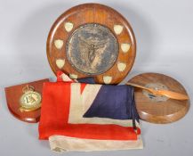 A collection of trophies and a 2nd world war era linen union jack flag,