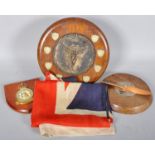 A collection of trophies and a 2nd world war era linen union jack flag,