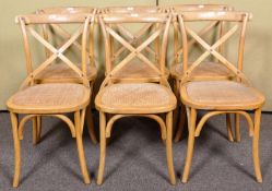 A set of six 20th Century vintage bentwood chairs with drop in padded straw weaved seats.