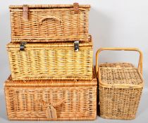 A Fortnum & Mason wicker weaved hamper along with other wicker baskets.