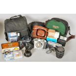A group of photographic items to include cameras and filter.