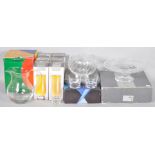 A collection of assorted boxed Dartington glass to include a cake stand and salad bowl