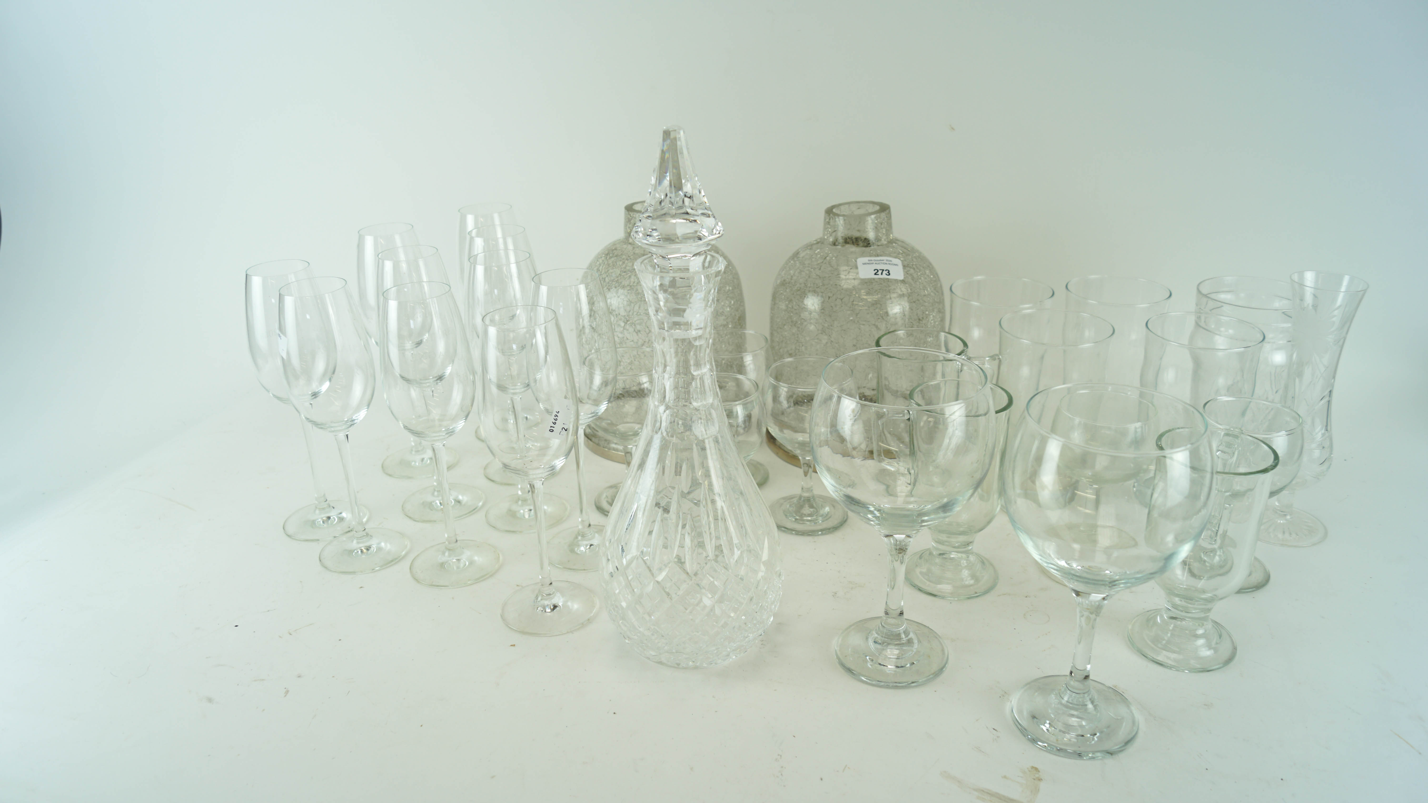 A large collection of wine glasses, pint glasses and more.