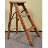 An early 20th Century oak folding step ladder stool. Measures; 52cm.