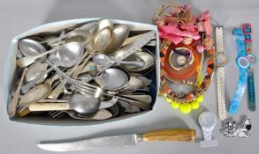 A collection of assorted flatware to include some silver plate