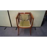 An Edwardian mahogany and inlay square framed salon tub chair having a a squared backrest