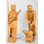 A pair of carved wooden figures depicting a 'The Lamplighter' and 'The Farrier'.