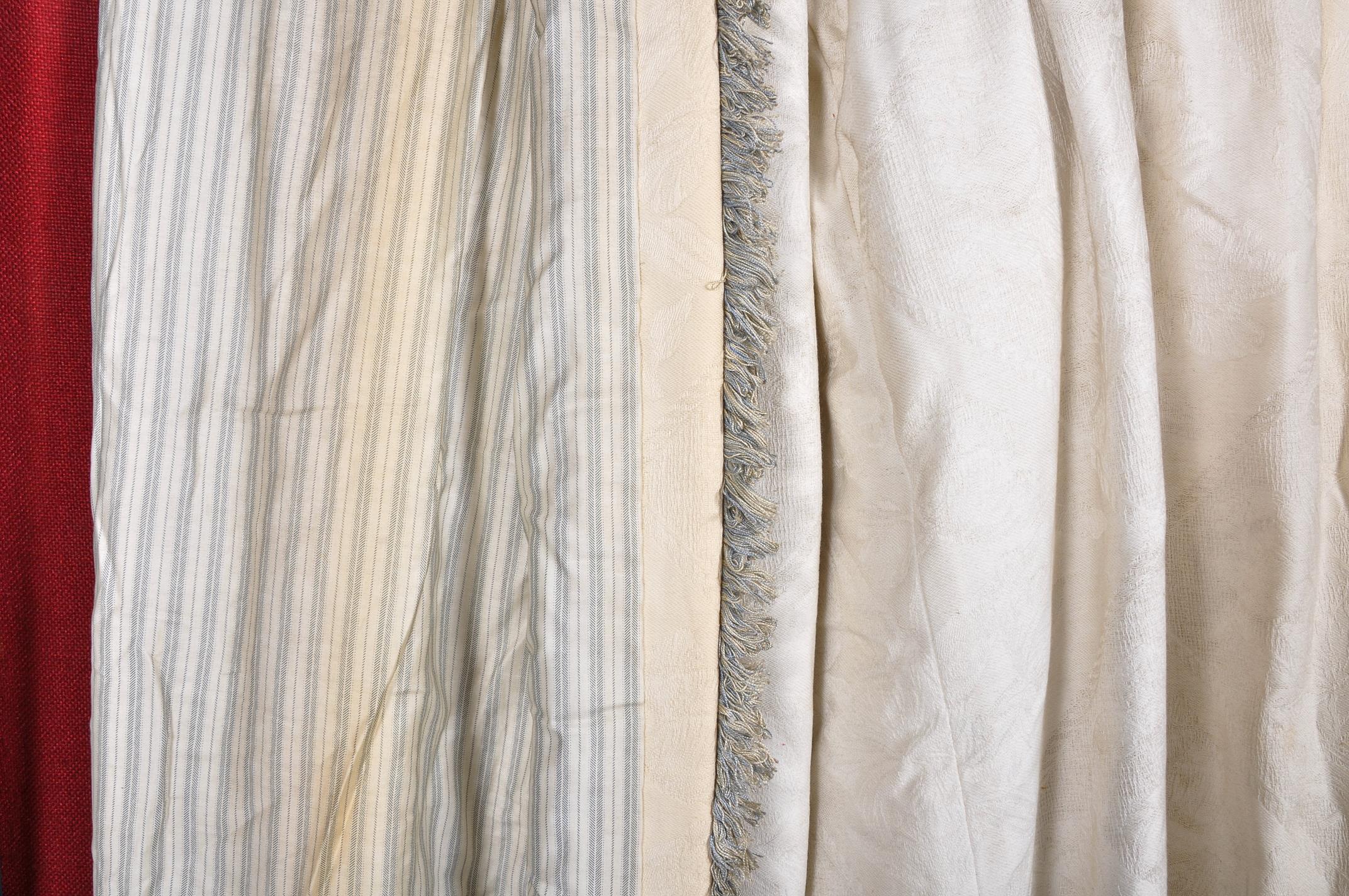 A pair of lined cream curtains