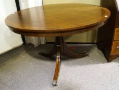 A George III style mahogany single pedestal round dining table; Measures; 119cm diameter.