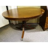 A George III style mahogany single pedestal round dining table; Measures; 119cm diameter.