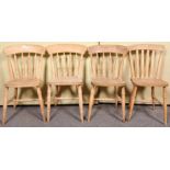 A set of three pine stick back dining chairs along with another. Measures; 85cm high.