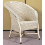 A Lloyd Loom armchair. Measures; 79cm high.