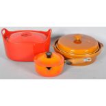 A group of kitchen wares, including a Le Creuset cast iron pan and cover,