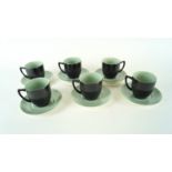 A set of six Branksome coffee cups and saucers in a two tone green and black colourway.