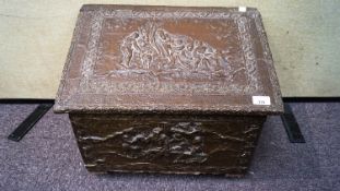 A 20th Century log box with brass relief decorated scenes with hinged lid atop