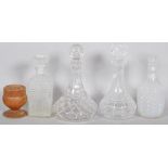 Four cut glass decanters,