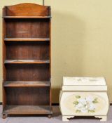 A painted trunk and an oak bookcase. Bookcase measures; 127cm high.