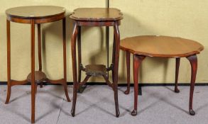 An Edwardian mahogany and inlay oval occasional table and two other tables.