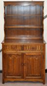 Oak dresser having a two drawer above cupboard base, height 178cm,