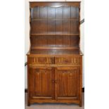 Oak dresser having a two drawer above cupboard base, height 178cm,