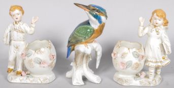 A Rosenthal model of a Kingfisher and a pair of Staffordshire spill vases