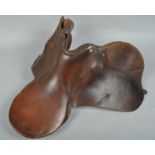 A brown leather saddle general purpose saddle from D ring to D ring 23cm the seat 42cm long