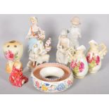 A collection of assorted ceramics and figures to include poole pottery and other items.