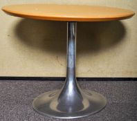 A contemporary coffee/centre table with aluminium tulip base