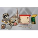 A collection of silver thimbles, a salt, a metal victorian candle-snuffer, penknives, badges,
