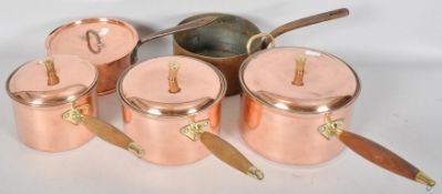 A mixed set of five copper saucepans and lids,