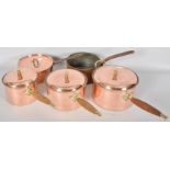 A mixed set of five copper saucepans and lids,