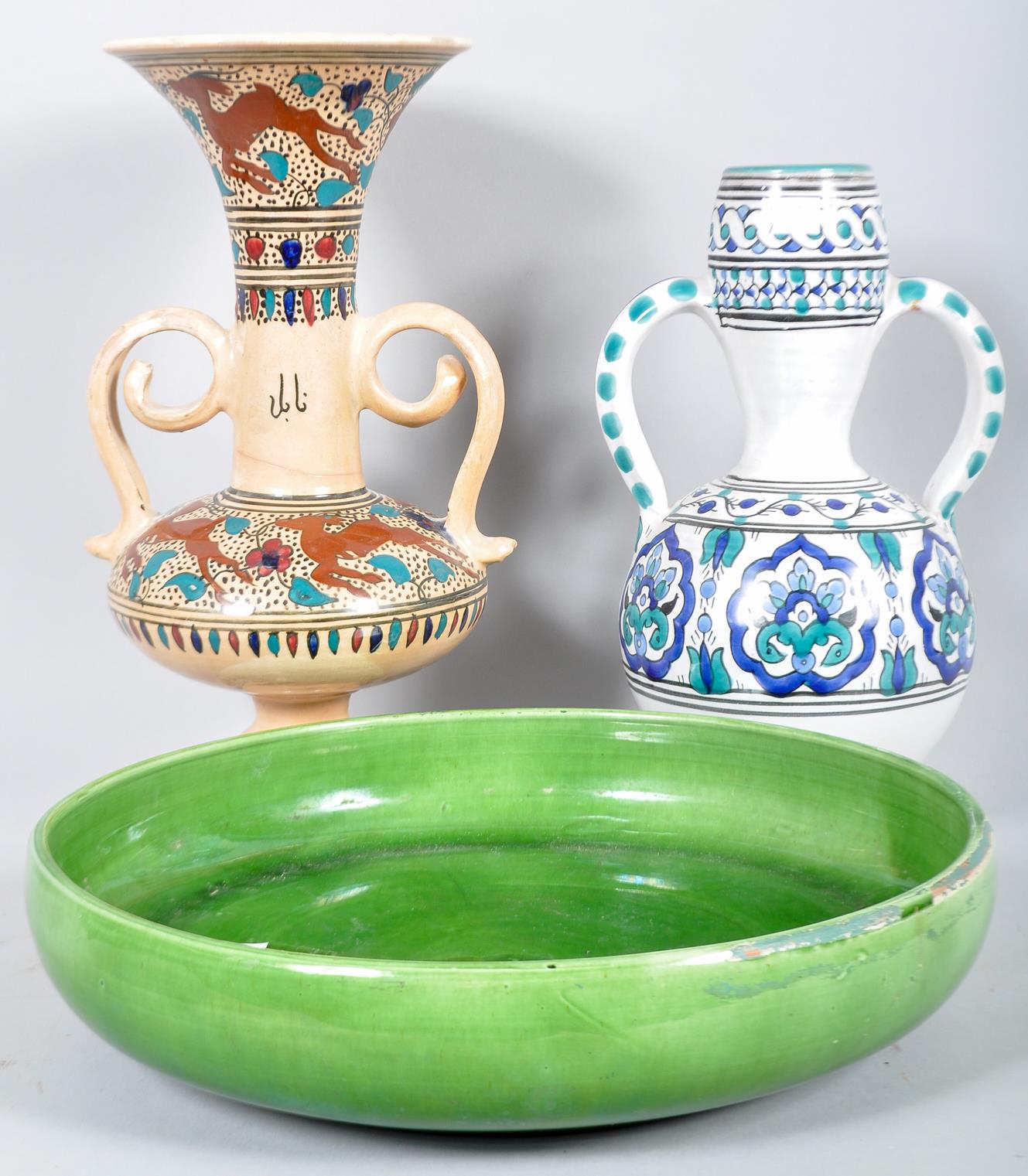 Two amphora type twin handled and painted vases along with a large terracotta green glazed dish.