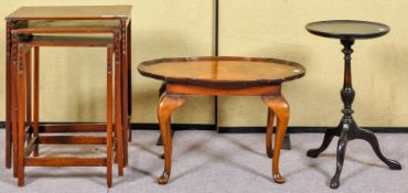 A nest of three tables, largest 41cm wide,