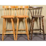 A set of three pine breakfast bar stools. Measures; 94cm high.