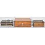 A collection of boxes to include a rosewood box with mother of pearl plaque