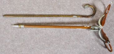 A silver mounted cane and a shooting stick