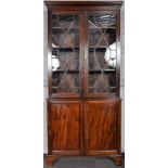 An Edwardian mahogany astragal glazed bookcase over drawers. Measures; 207cm x 97cm x 35cm.